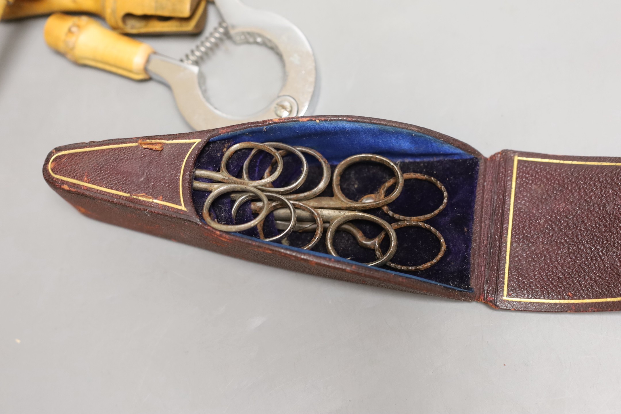A boxwood spinning top, cased set of scissors, oval patch box and boxed Asprey